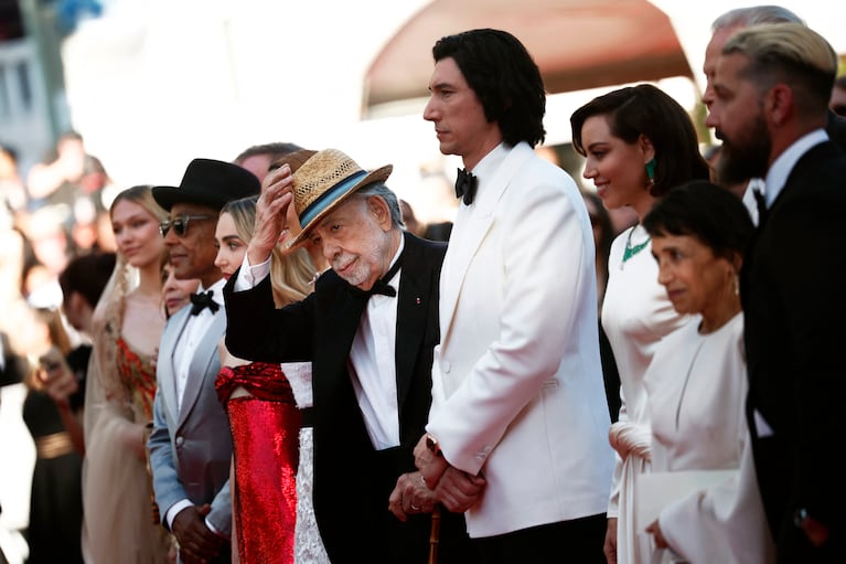 Director Francis Ford Coppola poses on the red carpet with cast members Aubrey Plaza and  Adam Driver, during arrivals for the screening of the film "Megalopolis" in competition at the 77th Cannes Film Festival in Cannes, France, May 16, 2024. REUTERS/Stephane Mahe