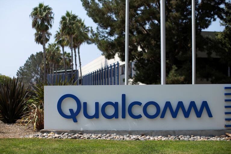 FILE PHOTO: A Qualcomm sign is shown outside one of the company's many buildings in San Diego, California, U.S., September 17, 2020. REUTERS/Mike Blake/File Photo