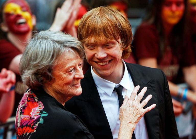 FILE PHOTO: Actors Maggie Smith and Rupert Grint share a light moment on the red carpet as they arrive for the world premiere of "Harry Potter and the Half Blood Prince" at Leicester Square in London, Britain July 7, 2009. REUTERS/Luke MacGregor/File Photo