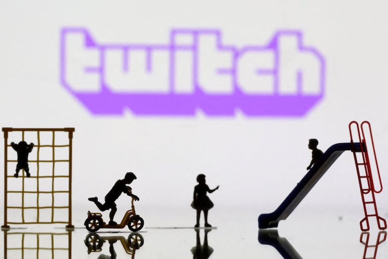 FILE PHOTO: Children playground miniatures are seen in front of displayed Twitch logo in this illustration taken April 4, 2023. REUTERS/Dado Ruvic/Illustration/File Photo