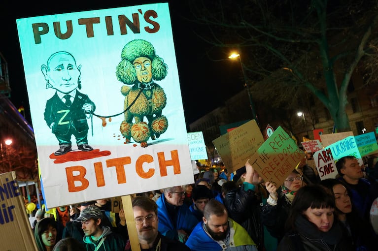 SENSITIVE MATERIAL. THIS IMAGE MAY OFFEND OR DISTURB    Ukraine supporters hold signs as they gather to mark the third anniversary of Russia's invasion of Ukraine, in Berlin, Germany, February 24, 2025. REUTERS/Lisi Niesner