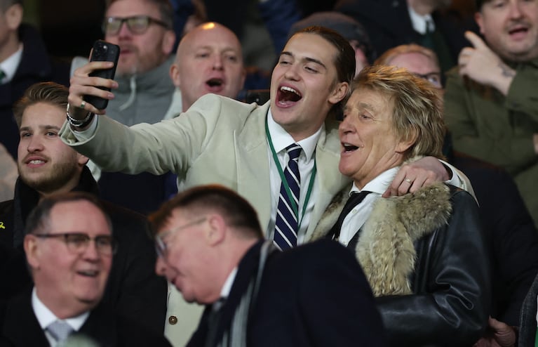 Soccer Football - Champions League - Celtic v BSC Young Boys - Celtic Park, Glasgow, Scotland, Britain - January 22, 2025 Singer Rod Stewart and his son Alastair Wallace Stewart take a selfie in the stands before the match REUTERS/Russell Cheyne